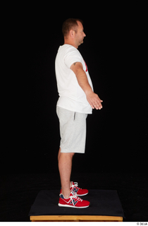 Louis dressed grey shorts red sneakers sports standing white t…
